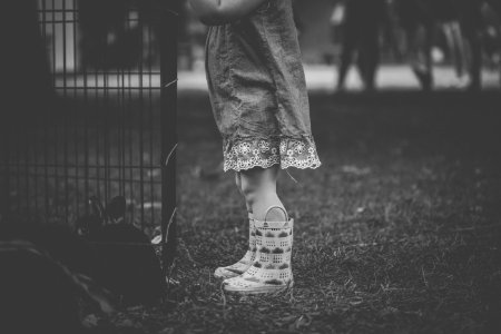 Monochrome Photography Of Children Wearing Boots photo