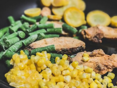 Vegetable And Meat On Black Plate