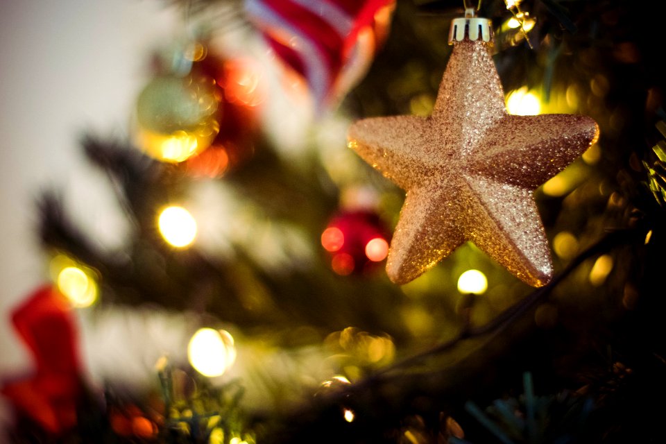 Selective Focus Photography Of Gold Star Bauble photo