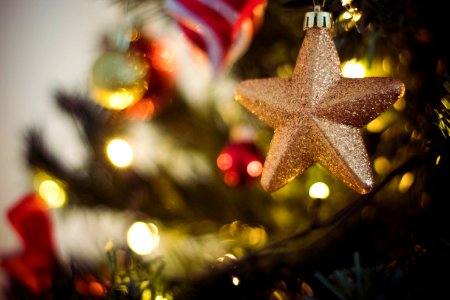 Selective Focus Photography Of Gold Star Bauble photo