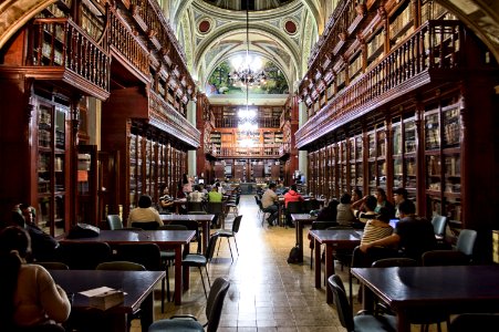 People At Library Sitting Down At Tables