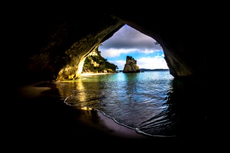 Gray And Brown Cave Near On The Ocean photo