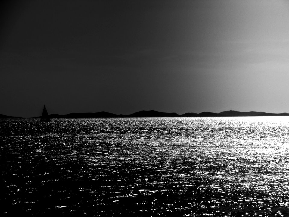 Grayscale Photo Of A Body Of Water