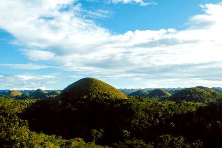 Scenic View Of Hills Surrounded By Trees