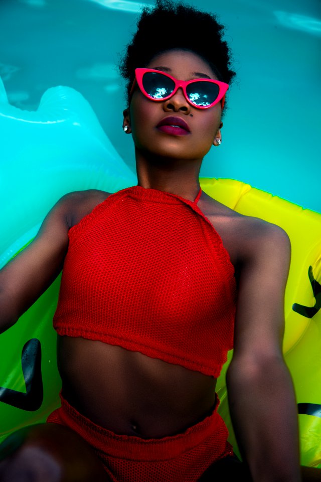 Woman Wearing Red Bikini On Float Talking Photo On Pool