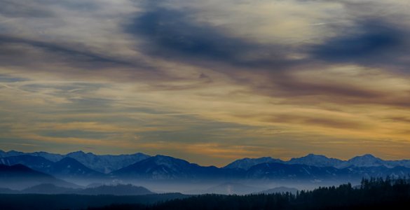 Tall Mountains Surrounded By Fogs Below The Clouds High-saturated Photography