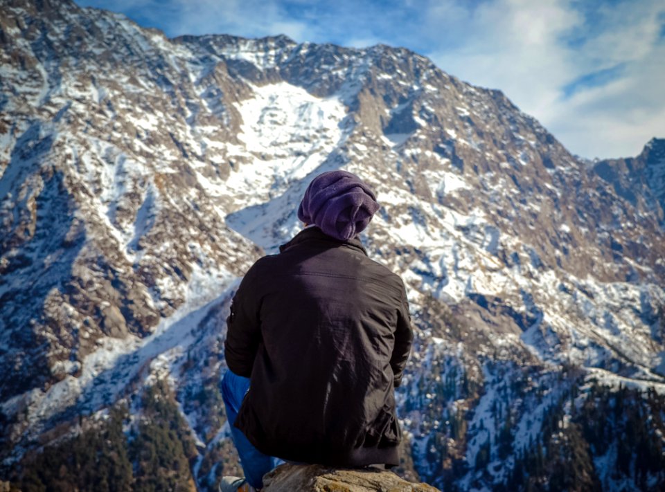 Person Sitting On Hill