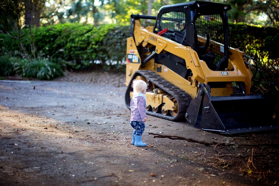 Toddler Stand Beside Front Loader
