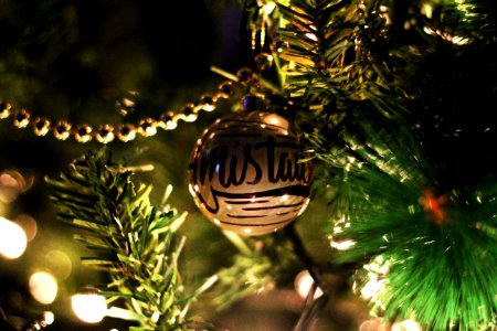 Gold Printed Bauble On Christmas Tree photo