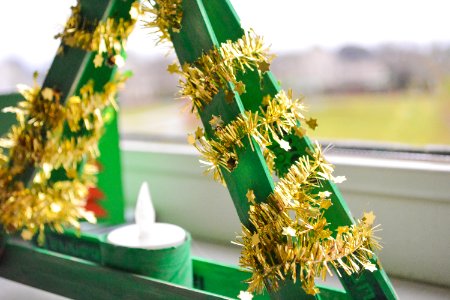 Shallow Focus Photography Of Green And Yellow Candle Holder With White Candle