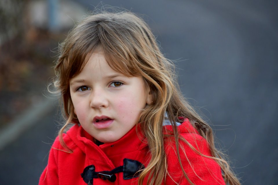 Blonde Girl Wearing Red Toggle Jacket photo