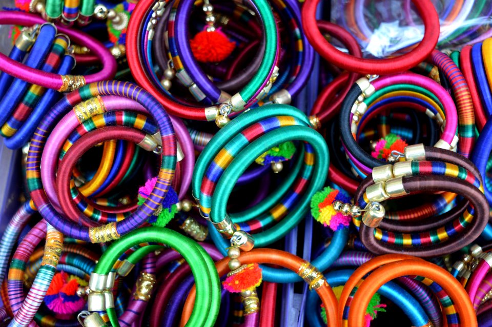 Pile Of Womens Assorted Colored Bangles