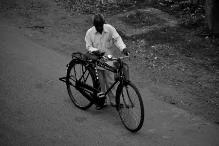 Man Beside Bicycle photo
