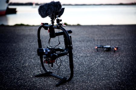 Shallow Focus Photography Of Black Quadcopter Near Body Of Water photo