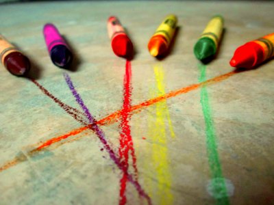 Six Crayons On Gray Concrete Floor