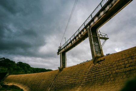 White Concrete Dam With Bridge photo