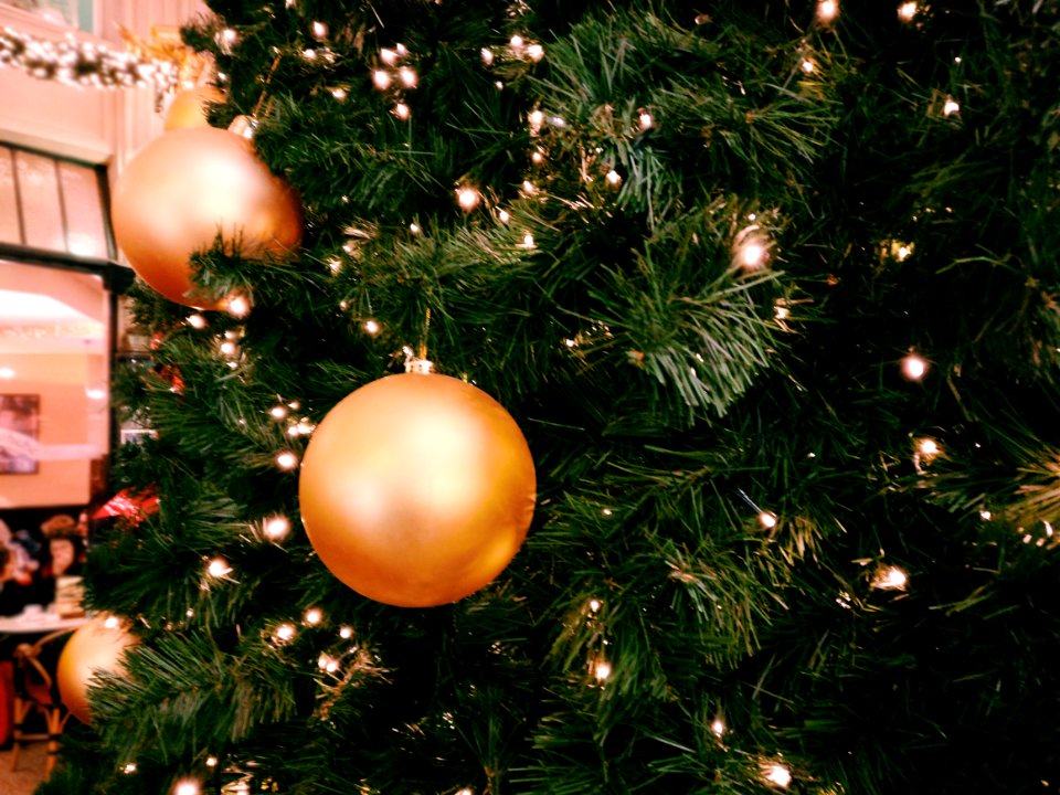 Green Christmas Tree With Three Round Gold Ornaments
