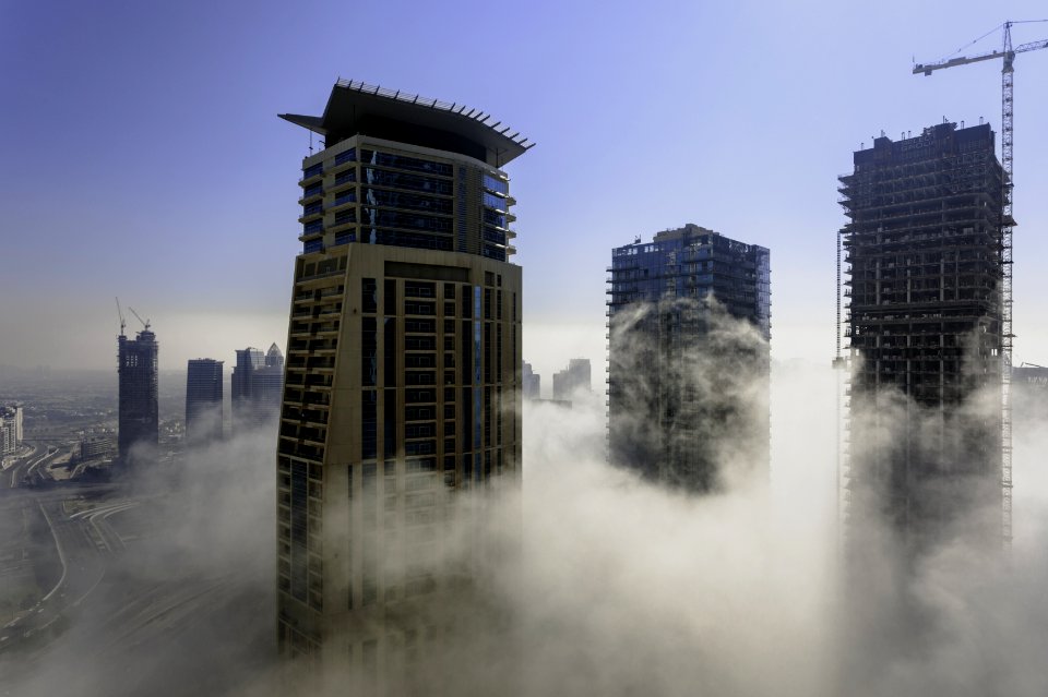 Three Brown High Rise Buildings