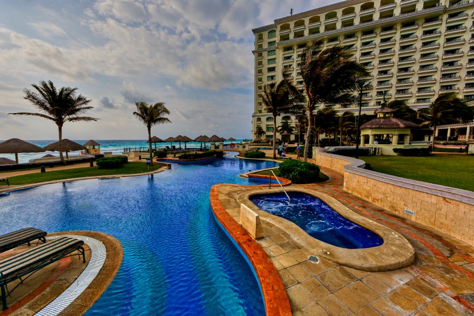 In-ground Pool Near Building During Daytime
