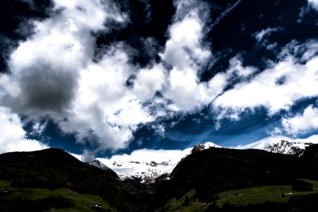 Photo Green Land Near Mountains Under Sky photo