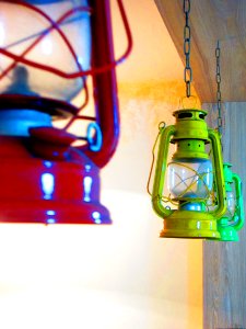Three Red Yellow And Green Gas Lantern Hanging On Ceiling