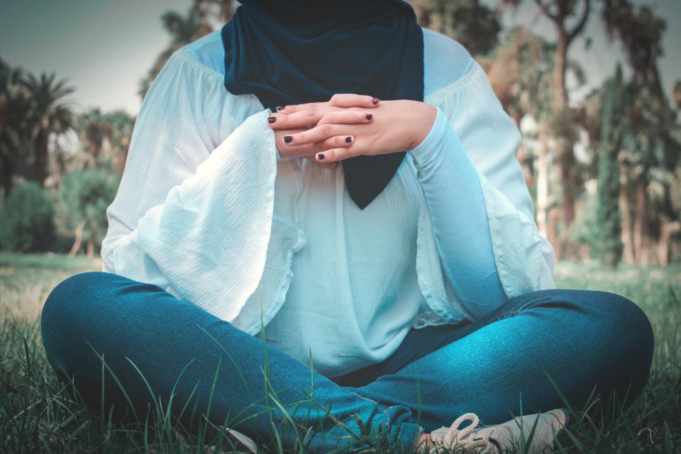 Woman In White Long-sleeved Shirt Sitting On Grass