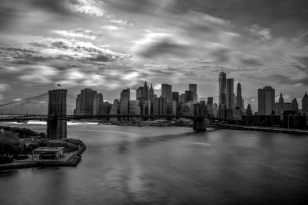 Grayscale Photography Of City Buildings And Bridge photo