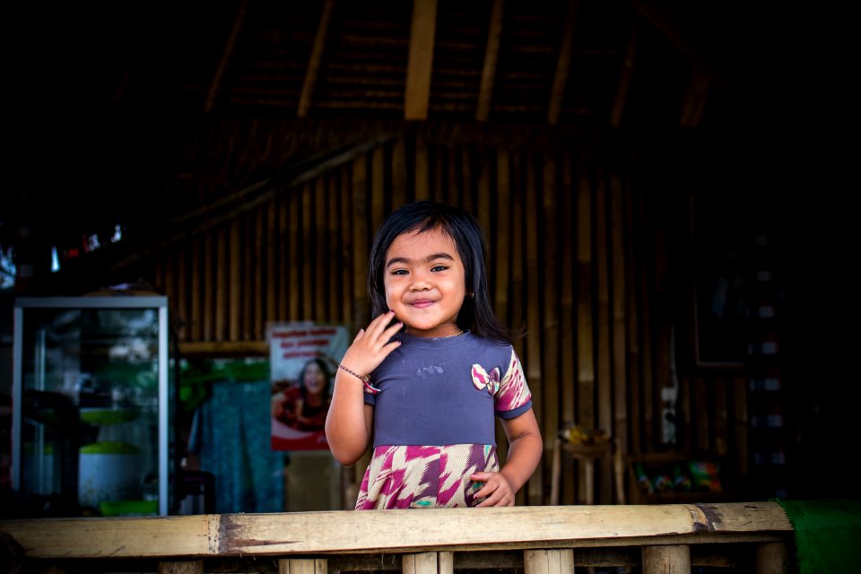 Toddler In Purple And White Dress