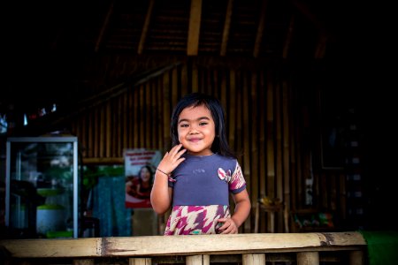 Toddler In Purple And White Dress