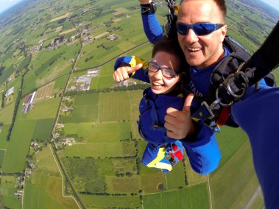 Couple In Blue Suit Paragliding