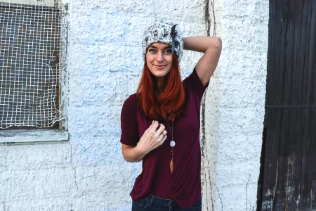 Woman In Maroon Top And Bluejeans photo