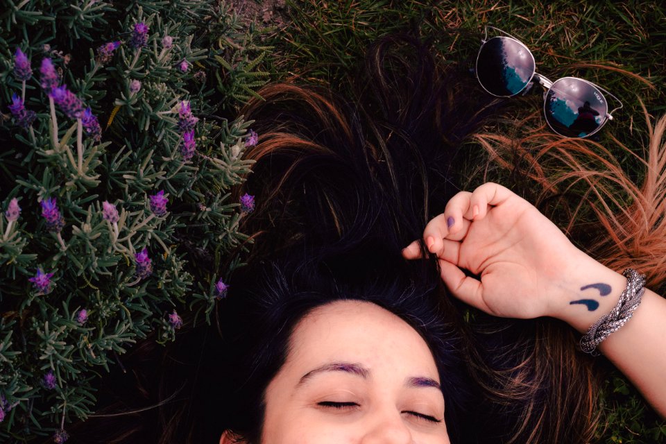 Woman Lying On Flower Field