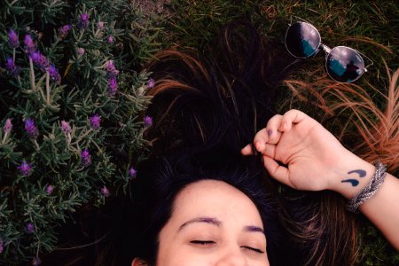 Woman Lying On Flower Field