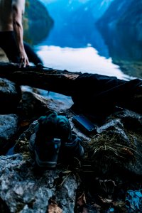 Pair Of Black Shoes And Black Smartphone On Brown Stone