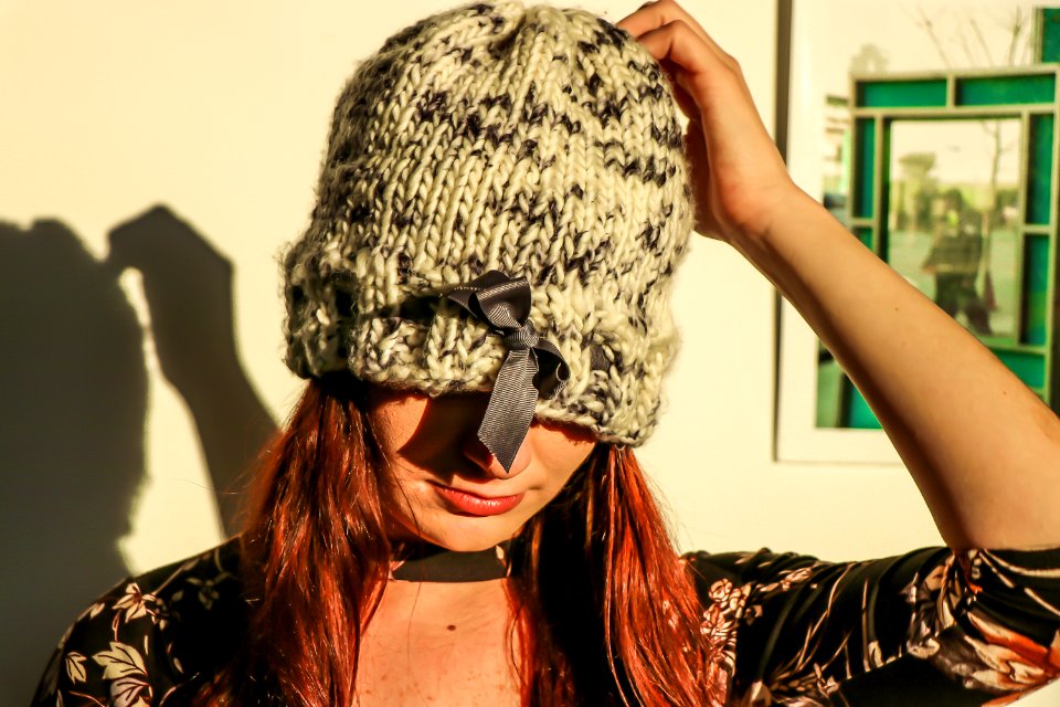 Closeup Photo Of Woman Wearing White And Black Knit Cap photo