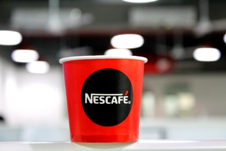 Red And Black Nescafe Coffee Cup photo
