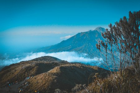 Landscape Photography Of Mountain Surrounded By Sea Of Clouds photo