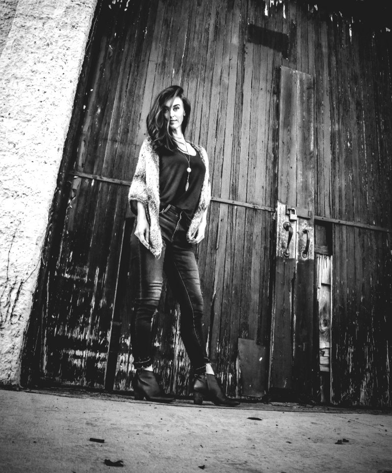 Gray Scale Woman Standing Near Door