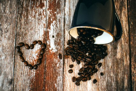 Black Ceramic Coffee Mug And Beans photo