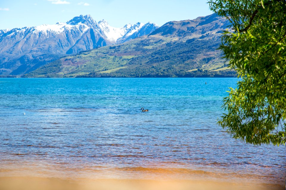 Landscape Photo Of Body Of Water With Mountain As Background