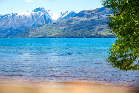 Landscape Photo Of Body Of Water With Mountain As Background photo