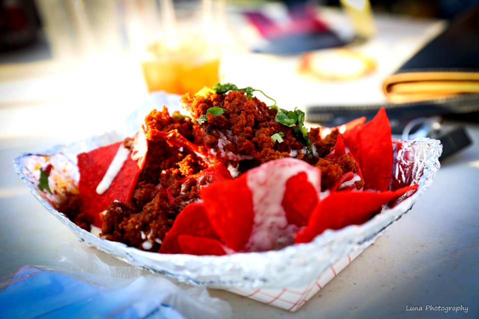 Food Photography Of Shredded Flakes And Red Chips Top With Parsley