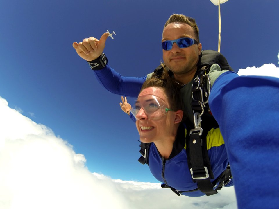 Man And Woman In Blue Jacket Doing Sky Diving