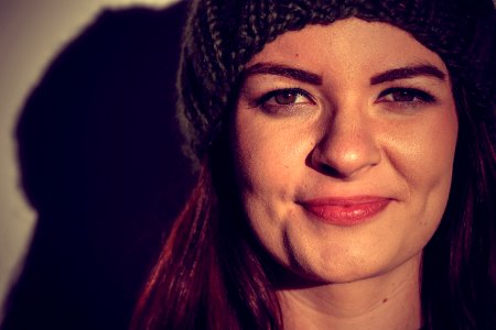 Woman Wearing Black Beanie Smiling For Photo