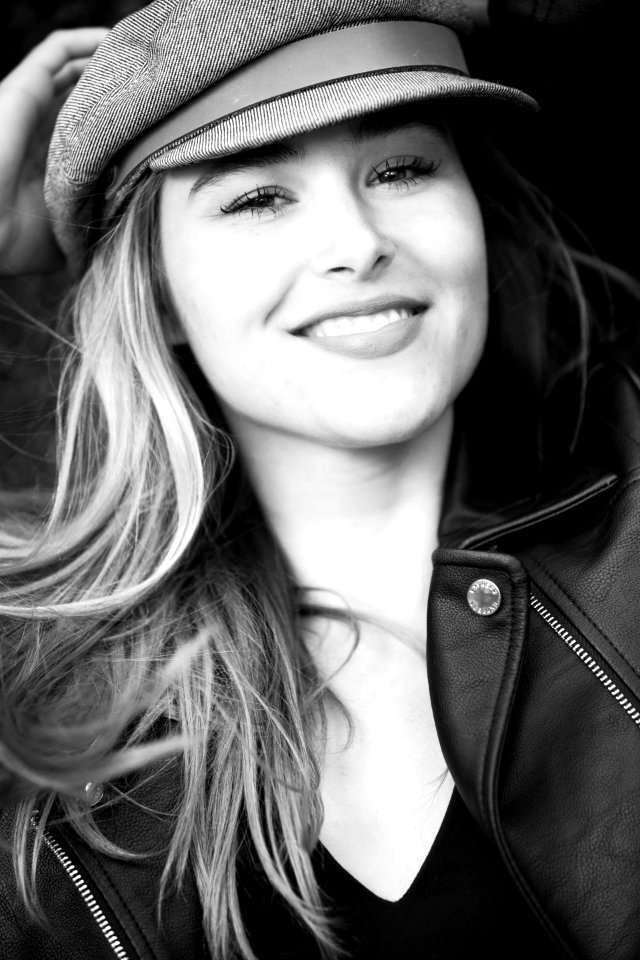 Grayscale Photography Of Woman Wearing Hat