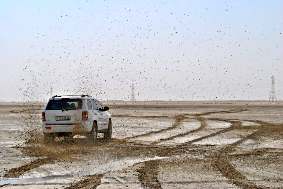 Photo Of White Suv On Muddy Plain