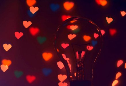 Photo Of Illuminated Hearts Around The Light Bulb photo