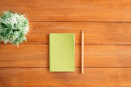 White Notes Beside A Pencil On Brown Wooden Surface photo