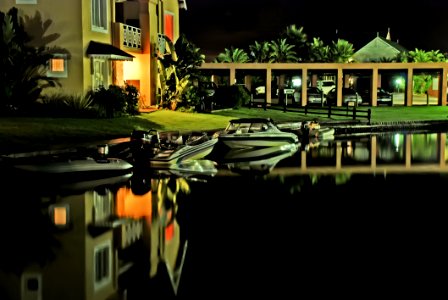 Speed Boats Docked Near House photo