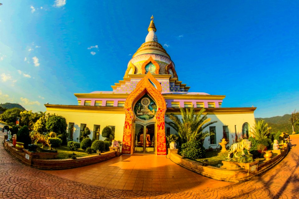 White Buddhist Temple With Blue Cloudy Background